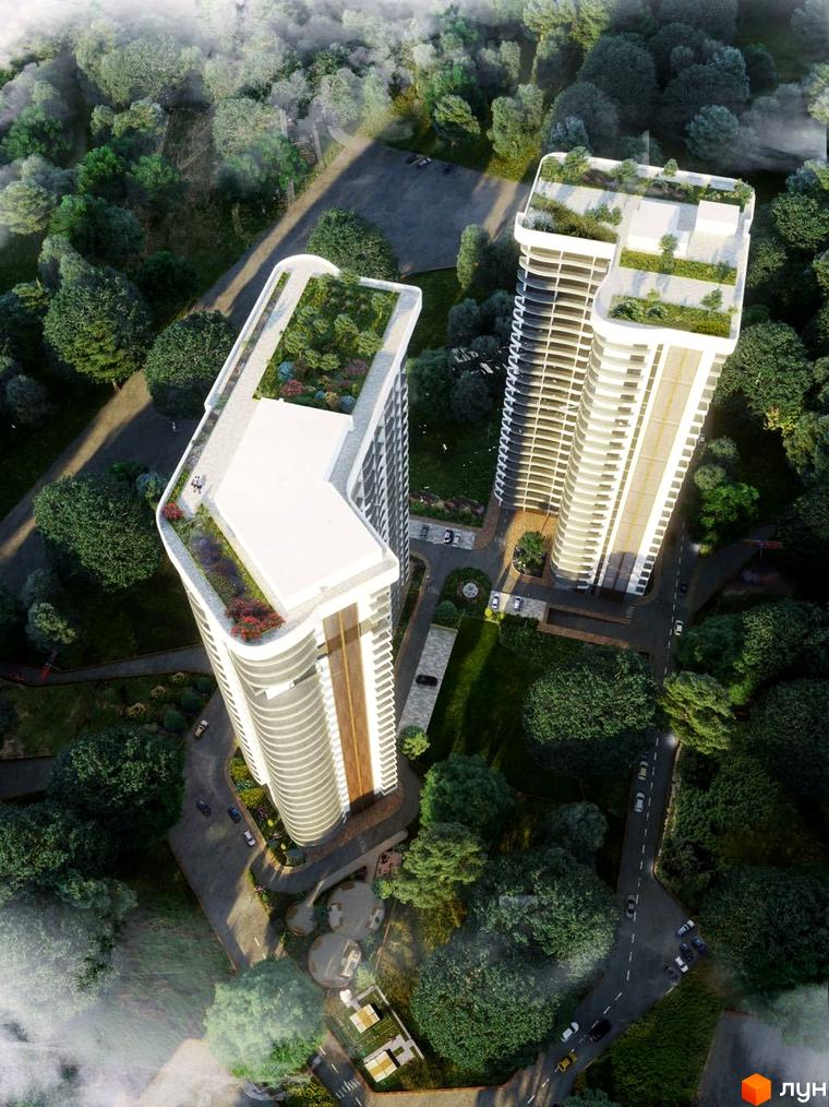 Вид зверху на Emporium Tower: дві висотні будівлі з зеленими насадженнями на даху. Навколо комплексу розташований зелений лісопарк.