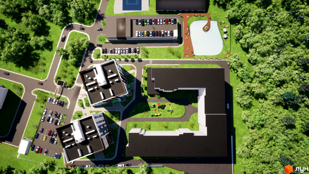 Аерофото житлового комплексу Wonderwood з багатоповерховими будинками, зеленими зонами, дитячим майданчиком та водоймою.