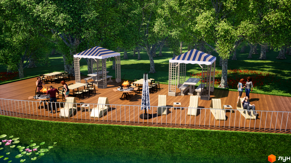 Прибудинкова територія житлового комплексу Wonderwood: дерев'яна тераса з альтанками, зоною барбекю та місцями для відпочинку серед зелених насаджень.
