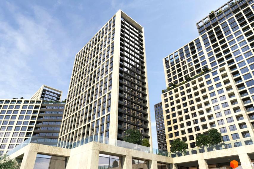 Багатоповерхові будинки ЖК Greenville на Печерську з великою кількістю вікон, скляними балконами та терасами на даху. На території комплексу висаджені дерева.