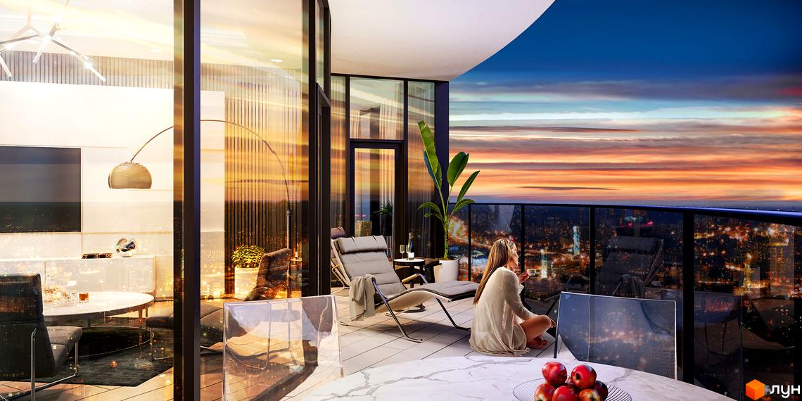 Taryan Towers - вид з балкона на захід сонця над містом. Сучасний житловий комплекс з панорамними вікнами та комфортними меблями на терасі.