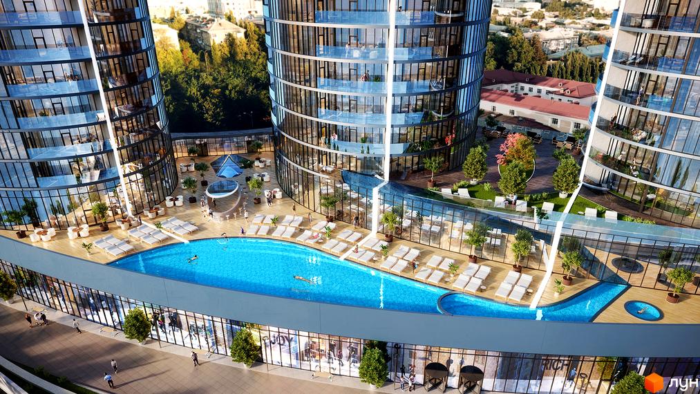 Taryan Towers - житловий комплекс з вигнутими фасадами та басейнами. На території розташовані зони відпочинку з шезлонгами та деревами.