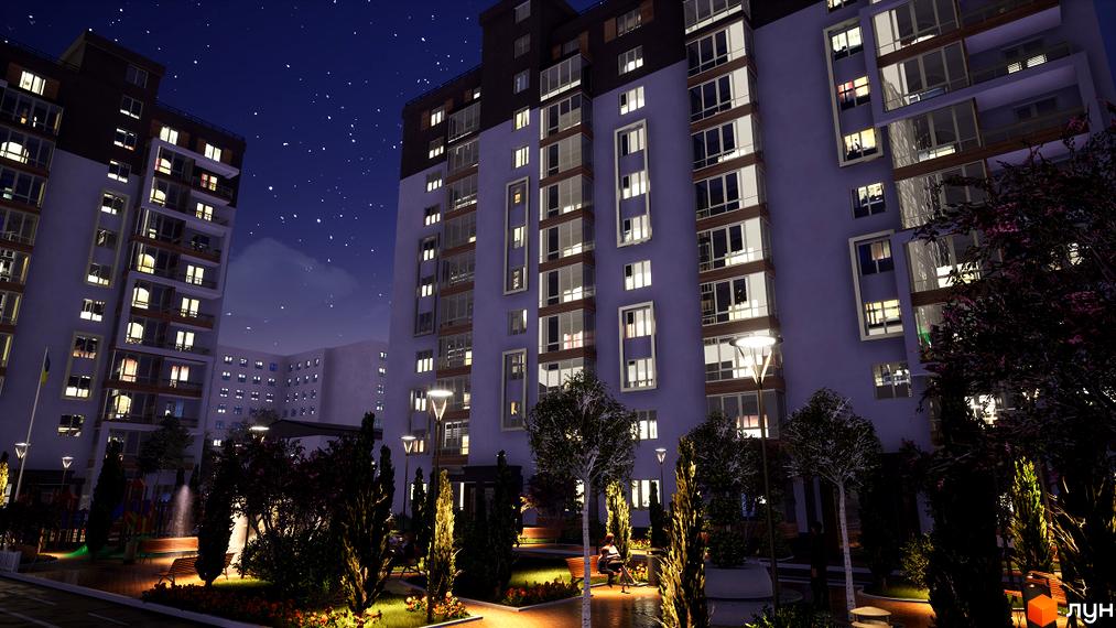 Комплекс Prestige Hall вночі з підсвіченими вікнами та балконами, зеленою прибудинковою територією та освітленими алеями.