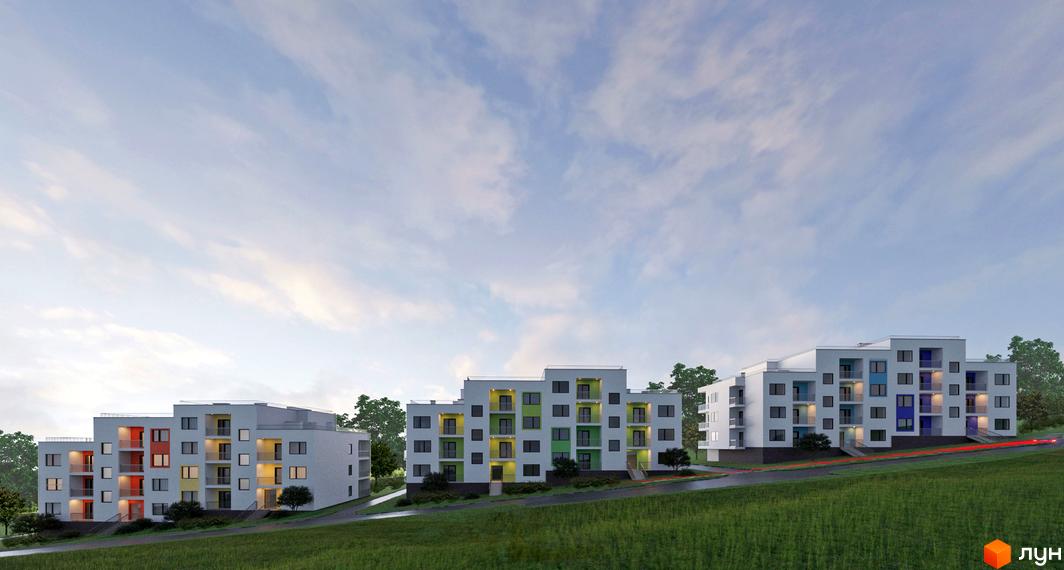 Три білі багатоквартирні будинки з кольоровими елементами на фасаді розташовані на схилі пагорба, оточені зеленню. Поруч проходить дорога.