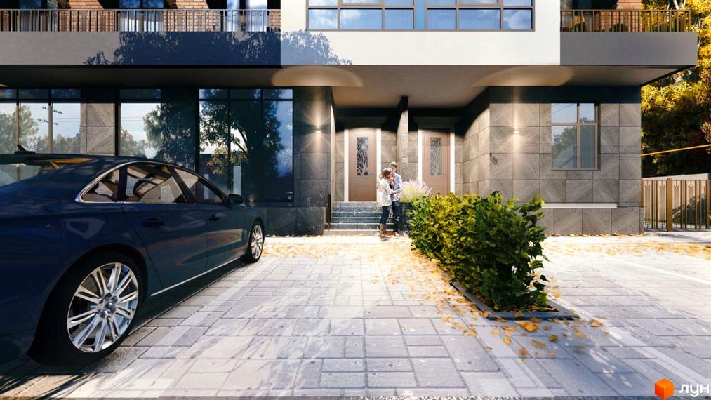 Фасад будинку Житловий комплекс Comfort Hall з темним облицюванням та великими вікнами. На передньому плані парковка з автомобілем та доглянутий кущ.