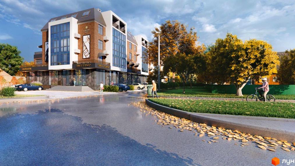 Житловий комплекс Comfort Hall з цегляним фасадом та великими вікнами. Поруч розташований доглянутий двір з деревами та місцями для відпочинку.