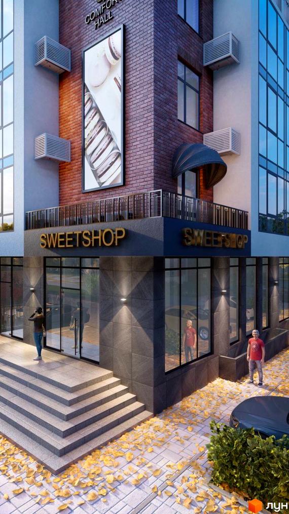 Зовнішній вигляд новобудови Comfort Hall з великими вікнами та вивіскою