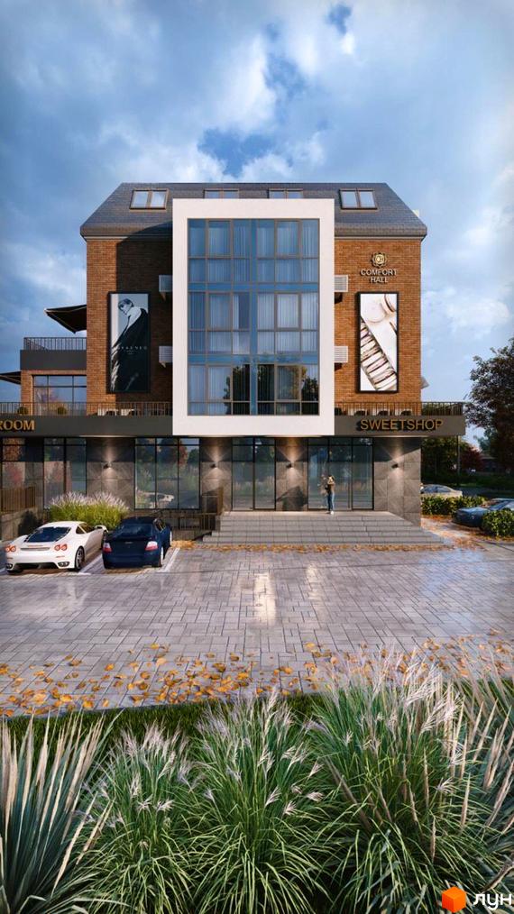 Новобудова Comfort Hall з цегляним фасадом та великими вікнами, перед якою розташована парковка та зелені насадження.