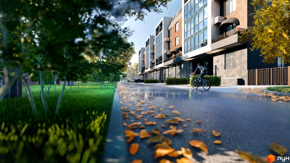 Житловий комплекс Comfort Hall: фасади будівель з панорамними вікнами та балконами, прибудинкова територія з деревами та дорогою.