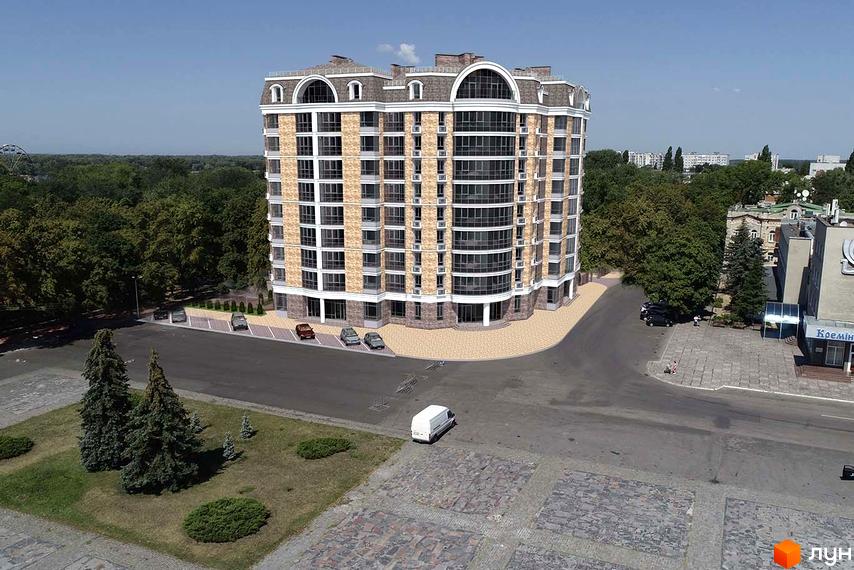 Зовнішній вигляд житлового комплексу City Park з цегляним фасадом та арочними вікнами. Навколо будинку розташована прибудинкова територія з деревами та парковкою.