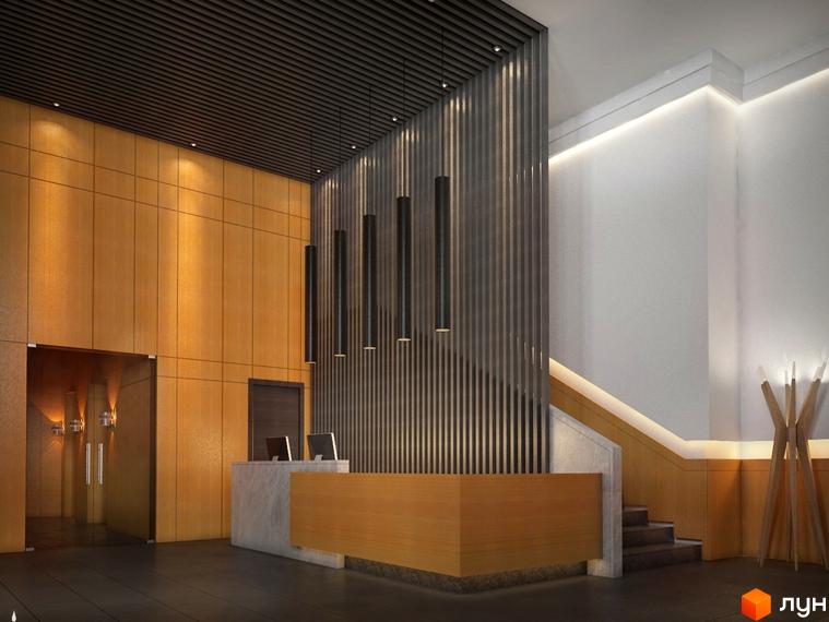 Сучасний інтер'єр холу житлового комплексу Галицький Млин з дерев'яними панелями, стійкою рецепції та підсвіченими сходами.