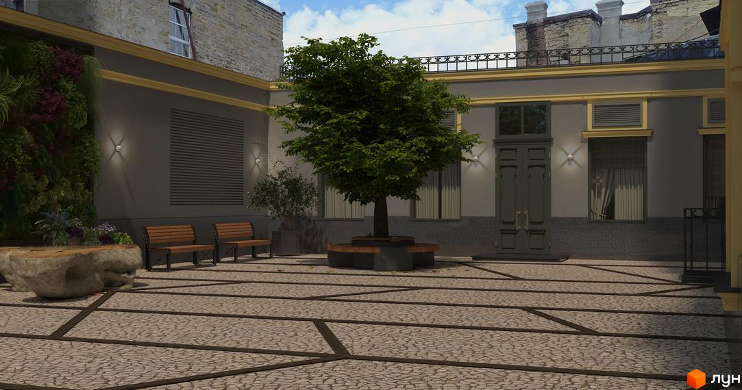 Житловий комплекс Вентімілья: затишний внутрішній двір з деревом, лавками та зеленими насадженнями. Бруківка та фасади будівель створюють привабливий простір.