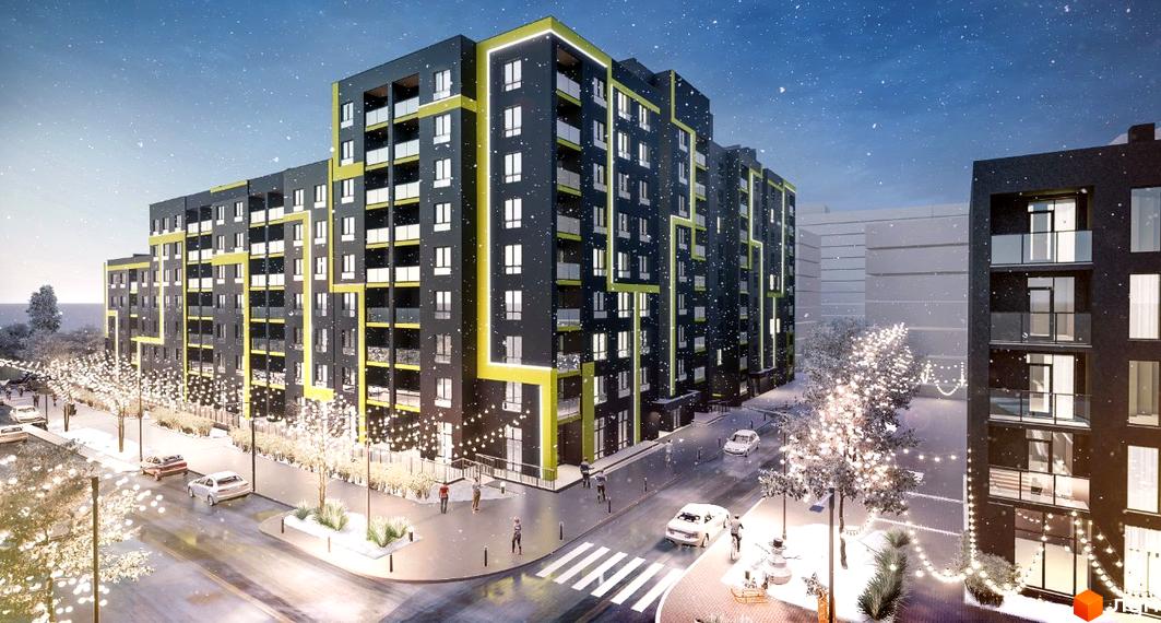 Зображення фасаду Житлового комплексу Шенген взимку. Навколо будівлі розташована прикрашена територія з деревами та освітленням.