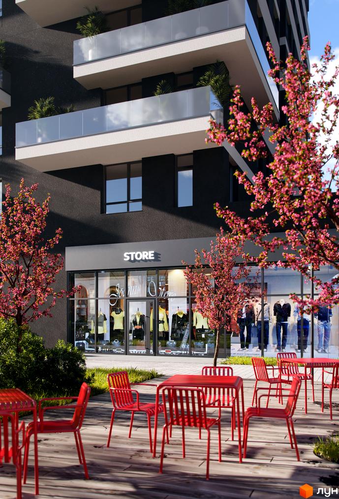 Зовнішній вигляд будинку Житлового комплексу Avalon Flex з магазином на першому поверсі. Перед будинком розташовані червоні столики.