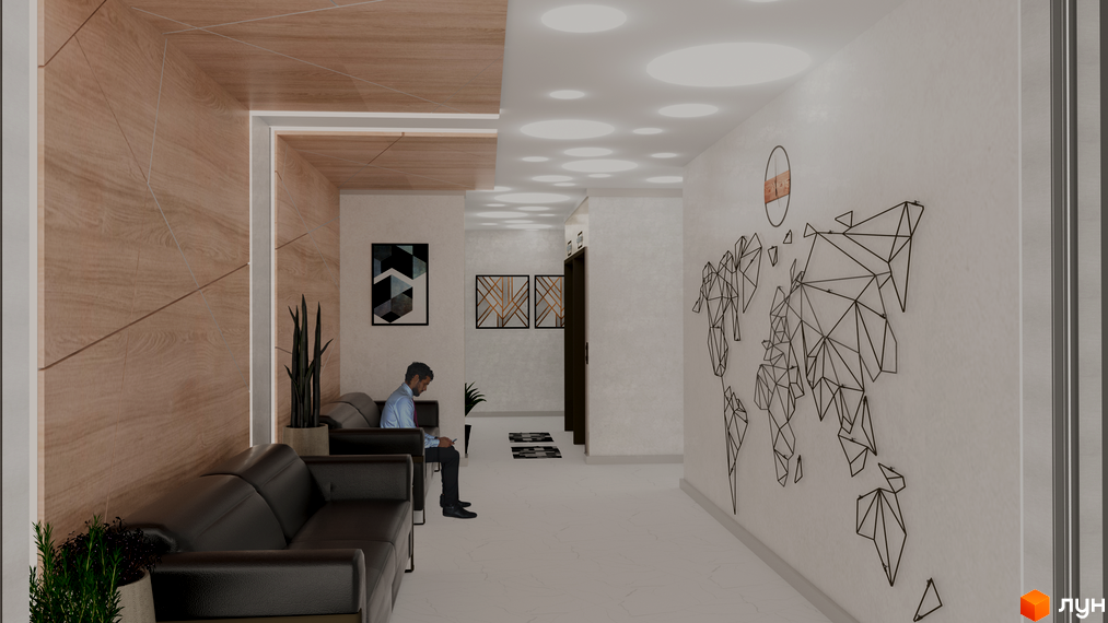 Дизайн холу житлового комплексу Wellspring з диванами, картиною світу та дерев'яними панелями на стінах. Сучасний інтер'єр для комфортного очікування.