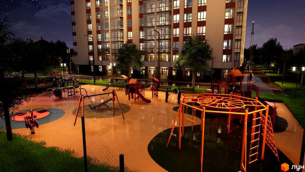 Житловий комплекс Акварель-4 з дитячим майданчиком увечері. Багатоповерховий будинок з підсвіченими вікнами та сучасно обладнаним дитячим майданчиком.