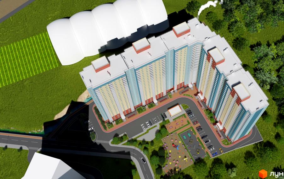 Зображення Житлового комплексу Акцент з висоти пташиного польоту. Видно багатоповерховий будинок та прибудинкову територію з дитячим майданчиком.