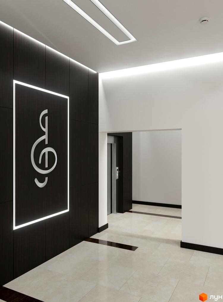 Інтер'єр вхідної зони Житлового комплексу Ярославенка з великим логотипом на чорній стіні та світлим мармуровим покриттям підлоги.