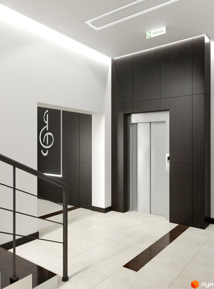 Інтер'єр холу в Житловому комплексі Ярославенка. Вигляд ліфтової зони та сходового майданчика з металевими поручнями.