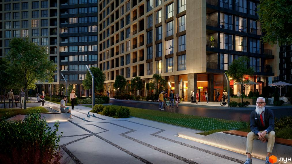 Житловий комплекс Greenville на Печерську з фасадом у світлих тонах та великими вікнами. На території комплексу облаштовані зони відпочинку та алеї для прогулянок.