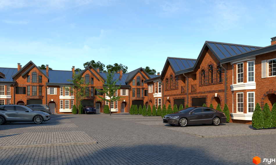 Цегляні таунхауси з синіми дахами. Простора прибудинкова територія з бруківкою та паркуванням для автомобілів.