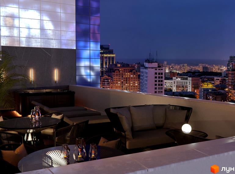 Житловий комплекс Skyline з терасою та міським пейзажем вночі. Затишна зона відпочинку з диванами, столиками та свічками на терасі.