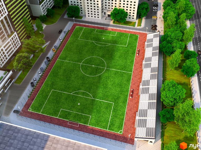 Багатоповерхові будинки Житлового комплексу Olympic Park з великим футбольним полем, біговою доріжкою та трибунами.