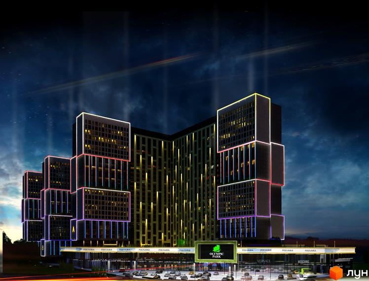 Зображення фасаду житлового комплексу Olympic Park з підсвіткою. Багатоповерхова будівля з магазинами на першому поверсі.