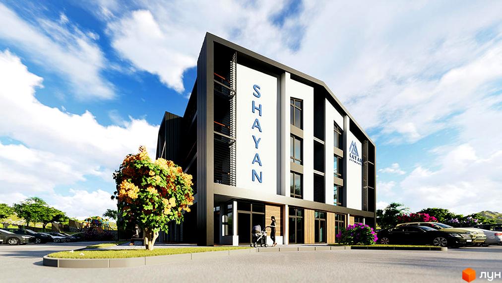 Фасад будівлі апарт-комплексу Shayan з великими вікнами та написом назви. На передньому плані - парковка з автомобілями та зелені насадження.