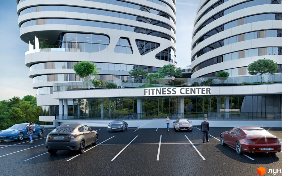 Зовнішній вигляд будівлі фітнес-центру в житловому комплексі INTERGAL CITY. Перед будівлею парковка з автомобілями.