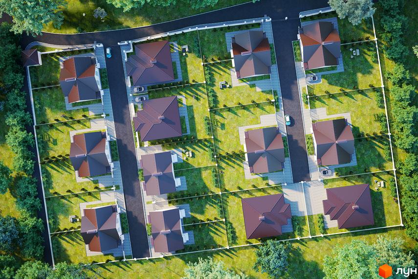 Вигляд зверху на Котеджне містечко Dream Wood з будинками з коричневими дахами та зеленими газонами. Навколо дерева та дорога.