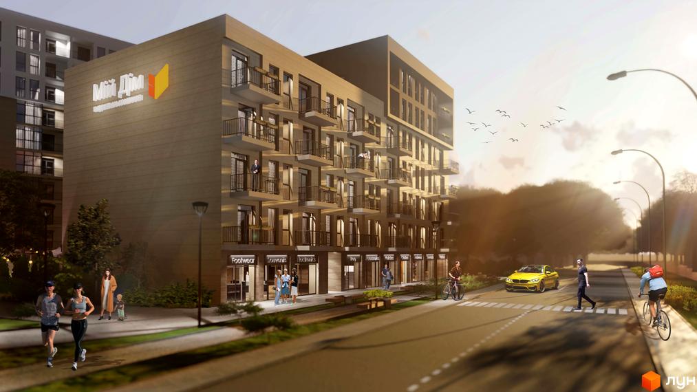 Зображення фасаду будівлі житлового комплексу з балконами, вітринами на першому поверсі та прилеглою територією з пішоходами та автомобілями.