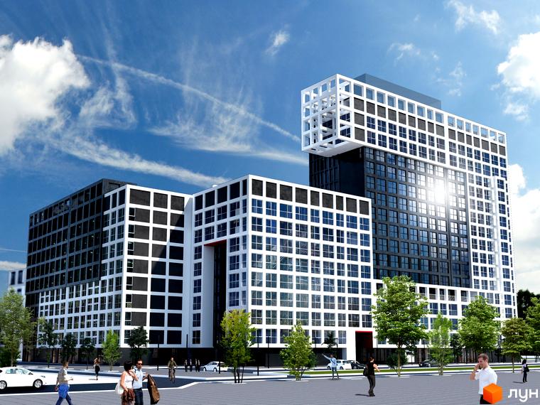 Комплекс Вільне Місто: багатоповерхові будівлі з контрастними фасадами, одна з яких має решітчасту надбудову. Навколо – озеленена територія.