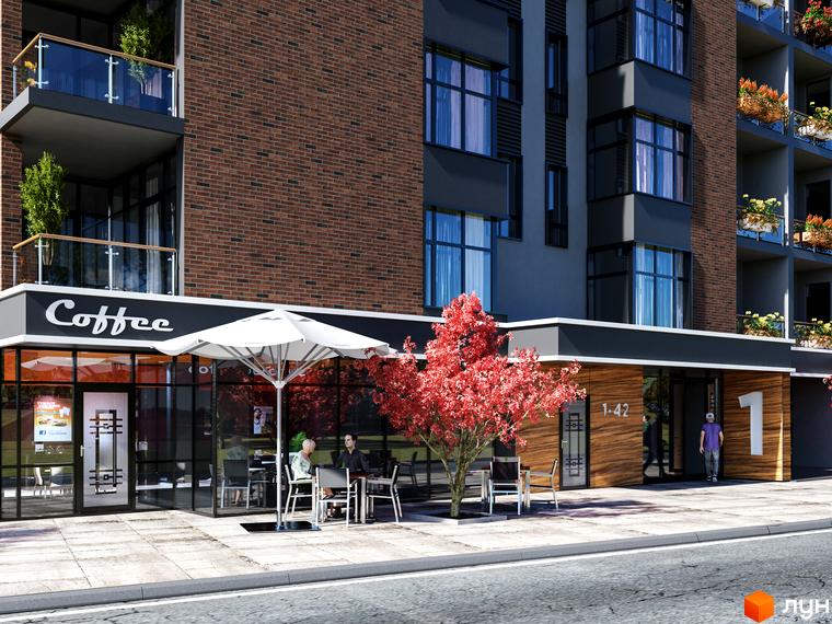 Житловий комплекс Manhattan з цегляним фасадом, темними елементами та балконами. На першому поверсі кав'ярня з літнім майданчиком та червоне дерево біля входу.
