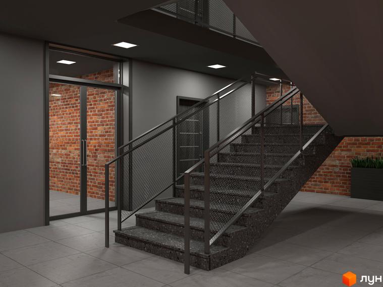 Сучасний дизайн сходової клітки в ЖК Клубне містечко 12 з цегляною стіною та металевими перилами.