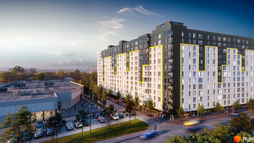 Висотна будівля Житловий комплекс Шенген з великою кількістю вікон. На території є парковка, дерева та дорога з рухом.