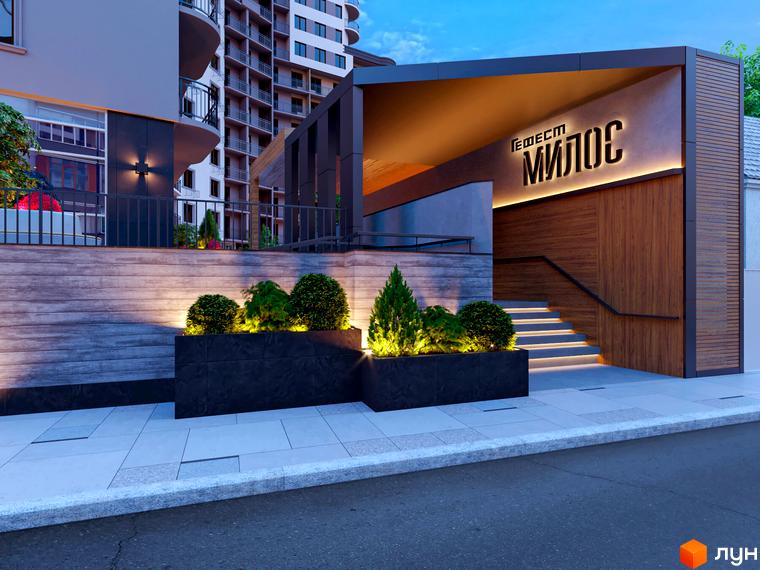 Вхід до будинку ЖК Мілос. Сходи, оздоблені деревом, ведуть до входу. На передньому плані тротуар та клумби з рослинами.