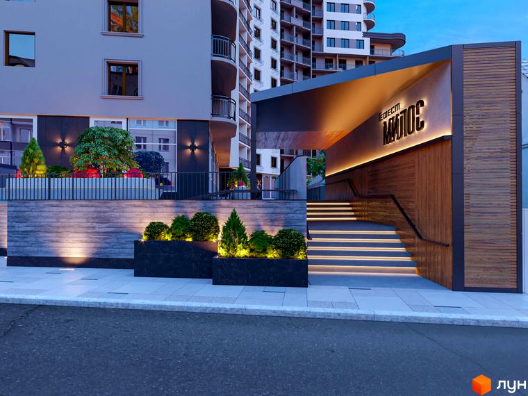 Вхідна група Житлового комплексу Мілос з освітленням та сходами. На передньому плані тротуар та зелені насадження.