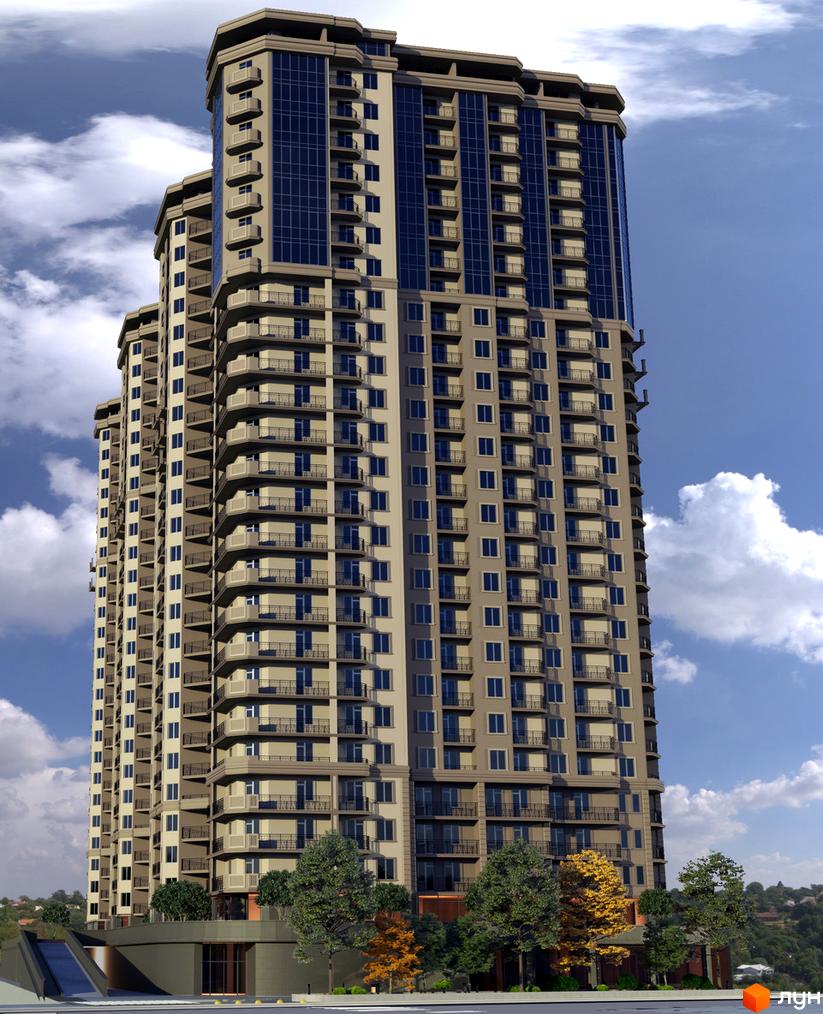 Висока багатоповерхова будівля з великою кількістю вікон та балконів. На передньому плані видно дерева та зелену територію.