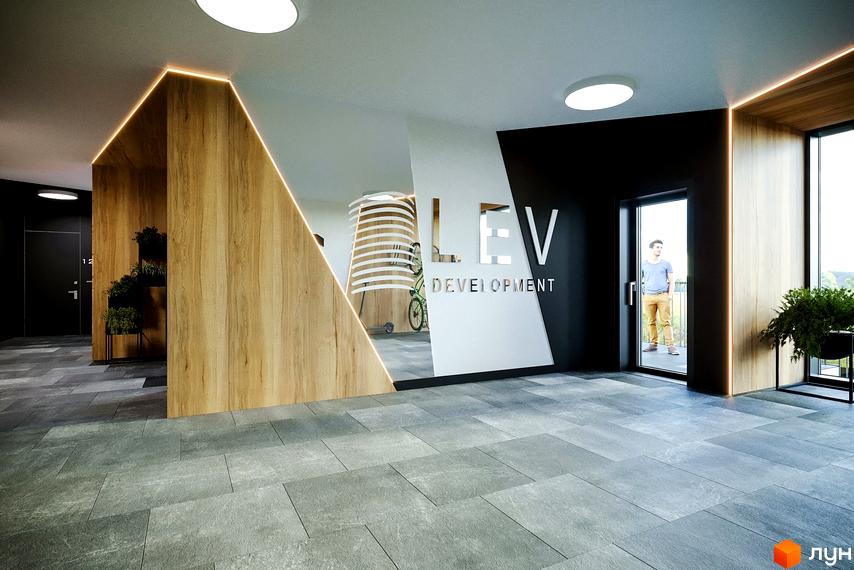 Інтер'єр холу житлового комплексу OBRIY2 з дерев'яними акцентами та логотипом компанії. Сучасний дизайн та освітлення створюють затишну атмосферу.