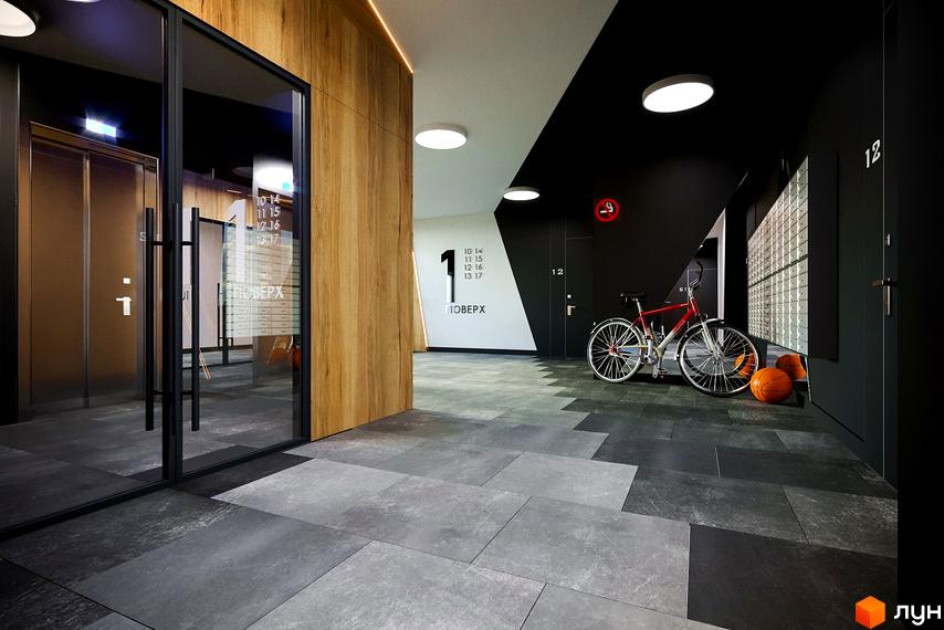 Житловий комплекс OBRIY2: внутрішній коридор з ліфтом, дерев'яними панелями та плиткою на підлозі. Біля дверей велосипед та м'ячі.