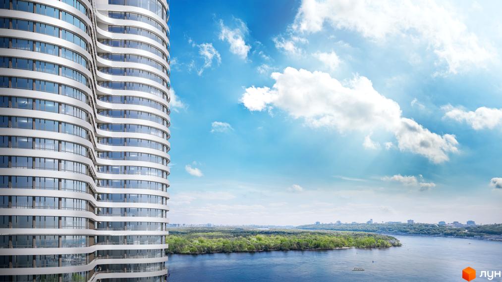 Житловий комплекс OASIS з вигнутим фасадом та панорамними вікнами, що виходить на річку та зелений острів.