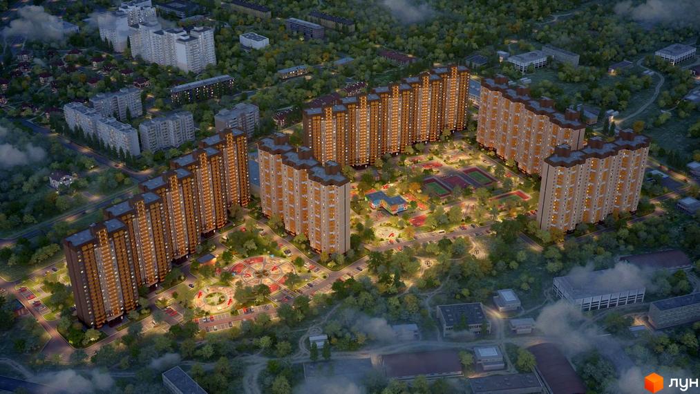Житловий комплекс Атлант у Коцюбинському: вид зверху на багатоповерхові будинки з коричневими фасадами та прибудинкову територію з дитячими майданчиками та спортивними зонами.