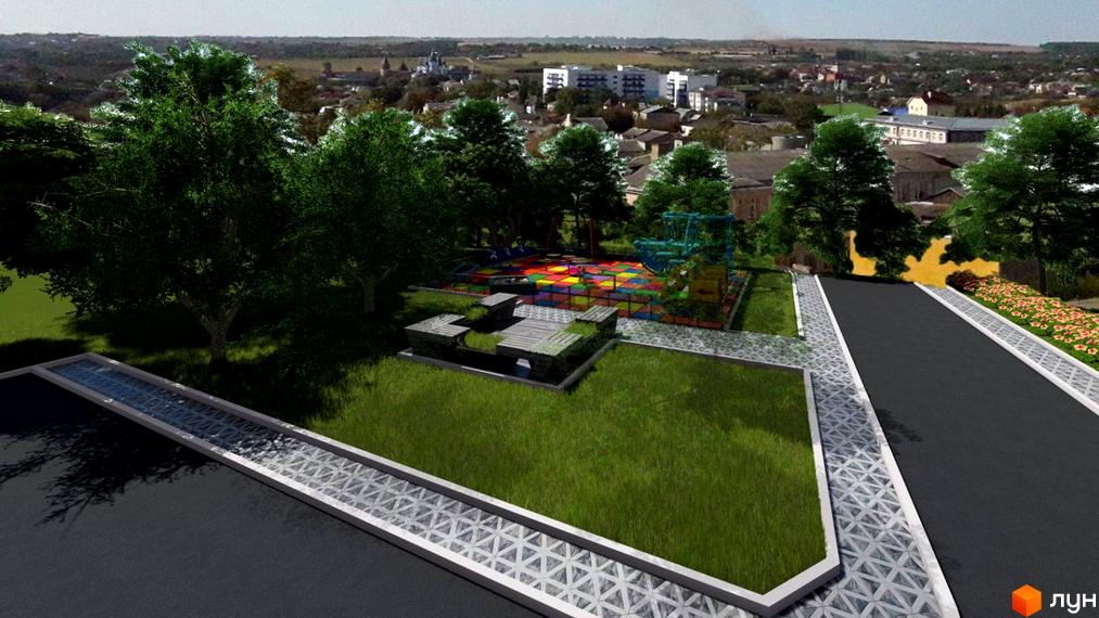 Зображення Житлового комплексу Райдужний з дитячим майданчиком та зеленими насадженнями. Вид на місто з новобудовами на задньому плані.