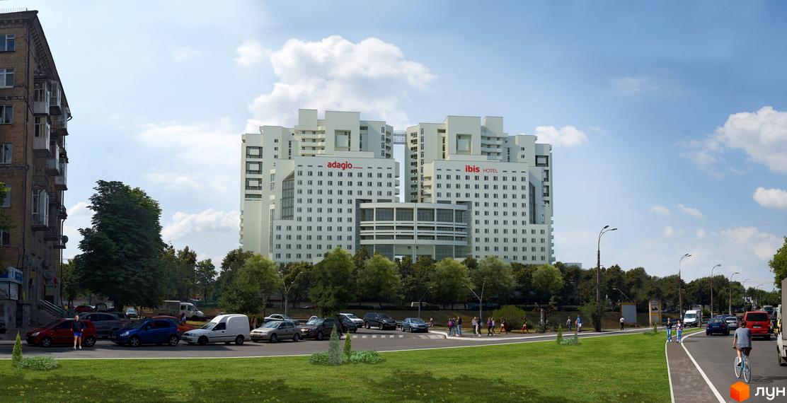 Новобудова ЖК Берестейський з фасадами Adagio та Ibis Hotel. Навколо комплексу зелена зона та дорога з автомобілями.