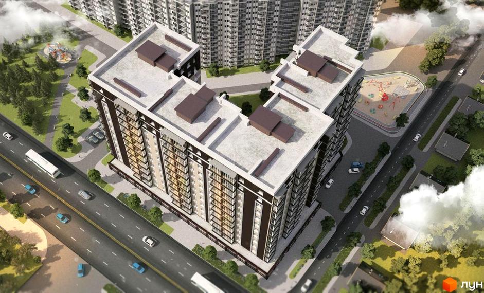 Зовнішній вигляд житлового комплексу Полісся 2 з висоти пташиного польоту. На зображенні видно багатоповерхові будинки з коричнево-білим фасадом, пласкою покрівлею та прибудинковою територією з дитячим майданчиком.