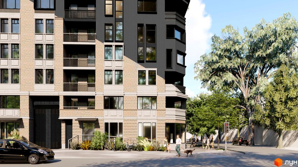 Зовнішній вигляд житлового комплексу Пространство на Шмидта з цегляним фасадом, балконами та великими вікнами. На прибудинковій території видно дерева та пішоходів.