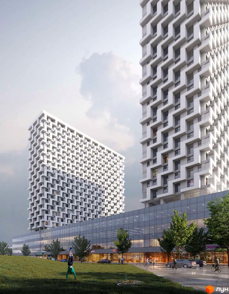 Зображення двох багатоповерхівок з великою кількістю вікон у Житловому районі BOSTON Creative House. На передньому плані зелений газон.