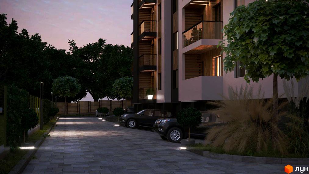 Житловий комплекс ECOtown: сучасна архітектура та затишна прибудинкова територія з освітленням та зеленими насадженнями.