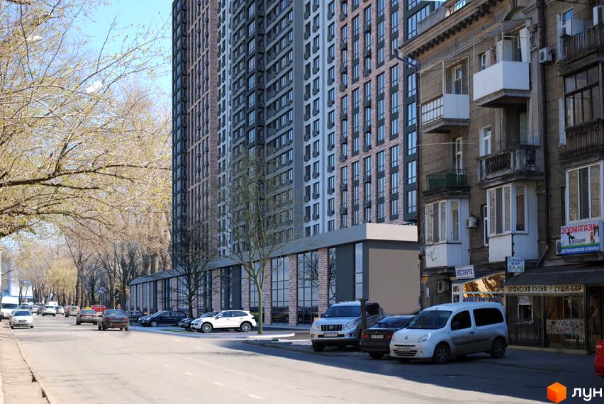 Зображення фасаду багатоповерхового будинку в Житловому комплексі Оскар. На передньому плані вулиця з припаркованими автомобілями.